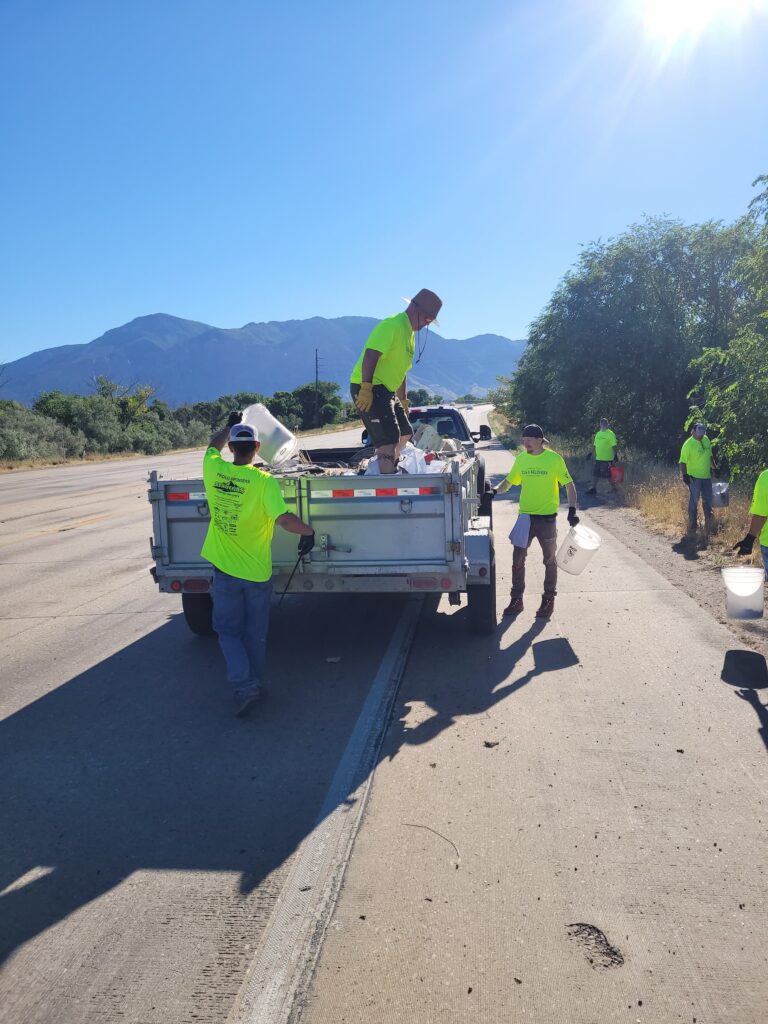 Tug 2 Recovery members actively participating in a local clean-up activity, contributing to the community and embracing productive lives.